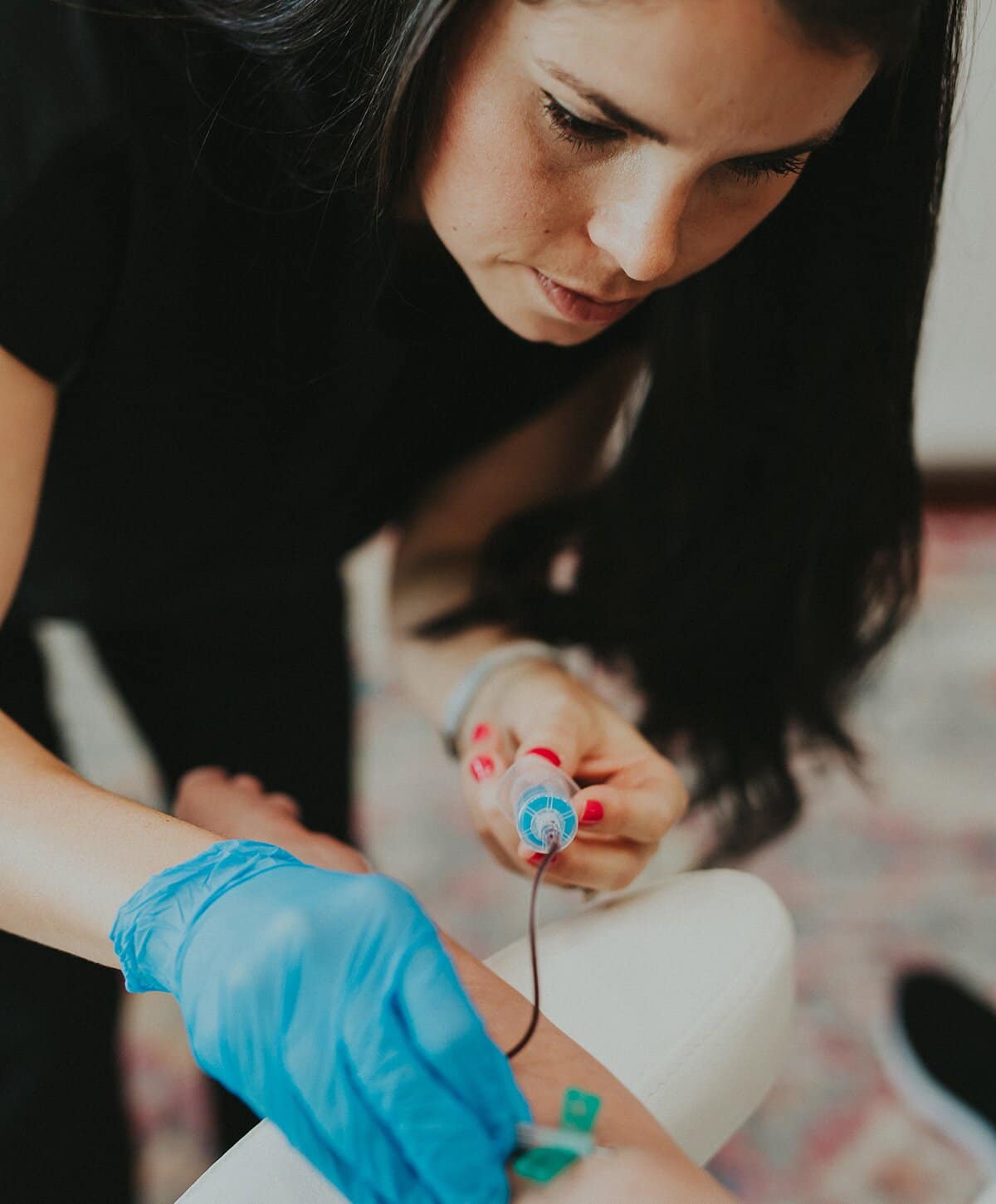 staff from The Refinery Texas doing an IV insertion