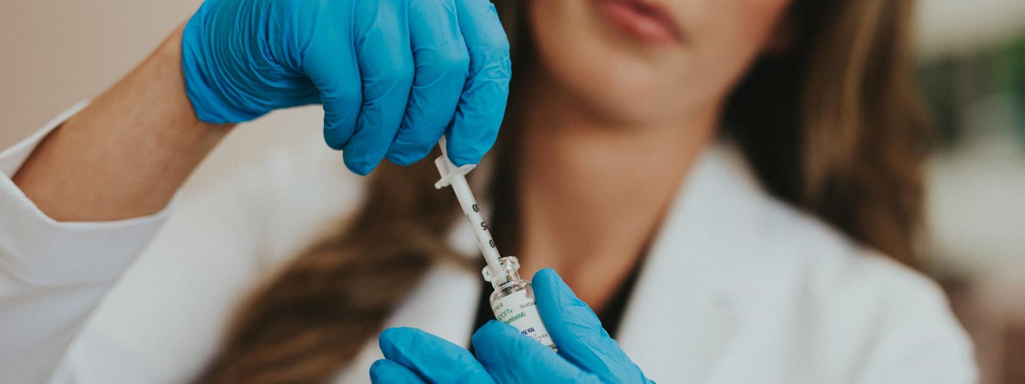 Woman Doctor filling syringe